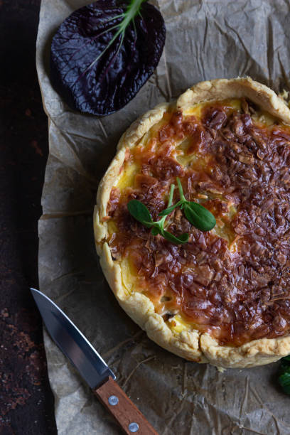 istock Homemade chicken, mushroom and potato open pie or quiche, dark rustic concrete background. French cuisine. 1292132719