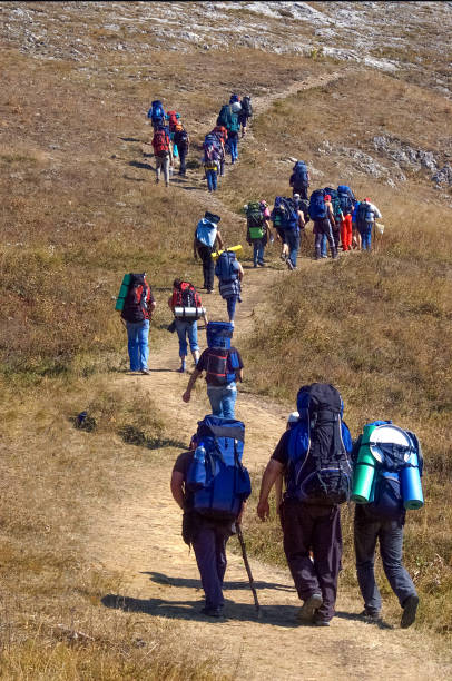 istock Hikers going on the hill of the mountain 1292132792