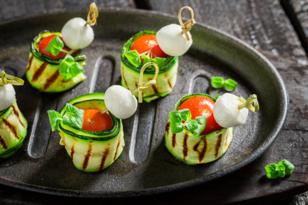 istock Homemade cold snacks with cheese, tomato and courgette 1292133168
