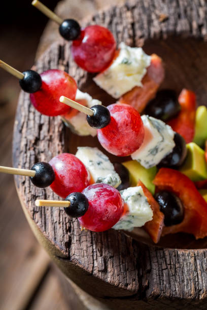 istock Homemade cold snacks with grapes, cheese and meat 1292134101