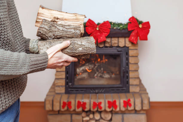 istock Chopped firewood in men's hands 1292134144