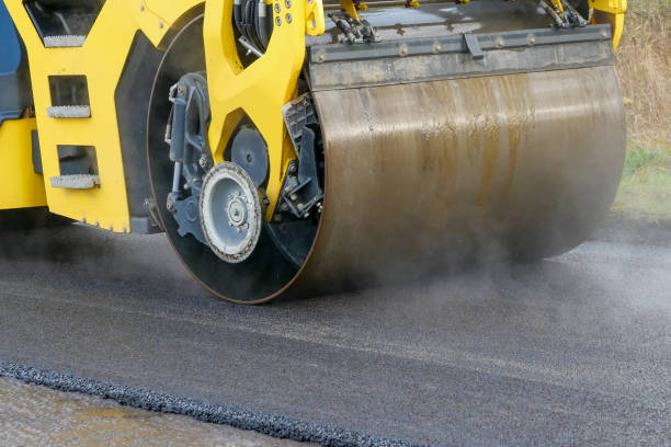 istock An asphalt drum compactor rolling newly laid tarmac 1292138984