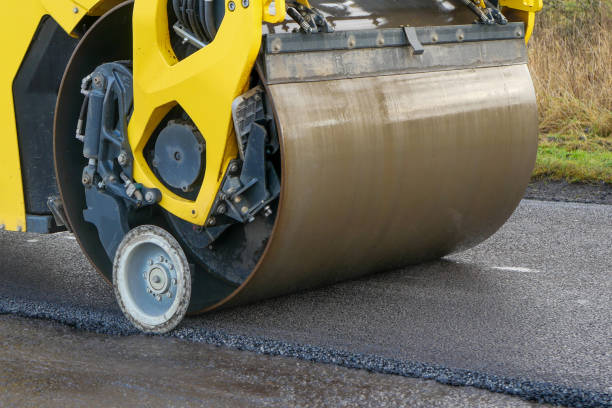 istock An asphalt drum compactor rolling tarmac in a straight line 1292138987