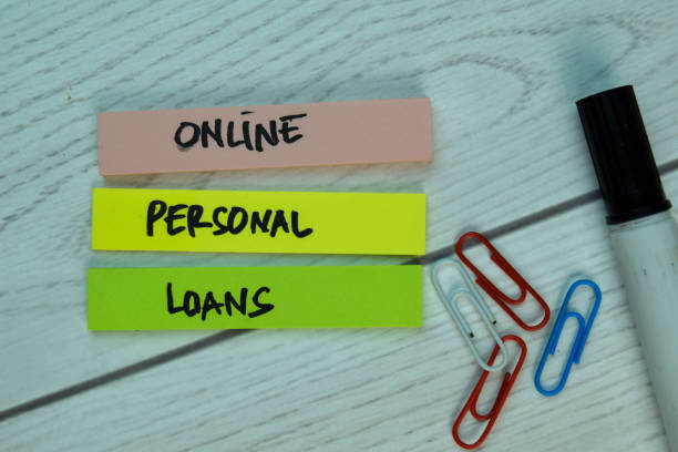istock Online Personal Loans write on sticky notes isolated on office desk. 1292142519