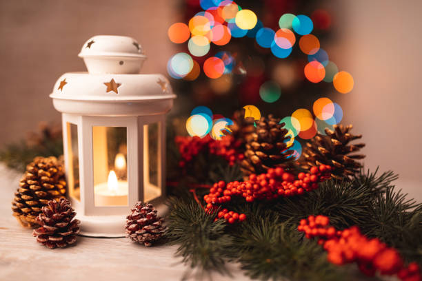 Christmas lantern with fir tree branch and decorations. Cozy scene for New Year holidays