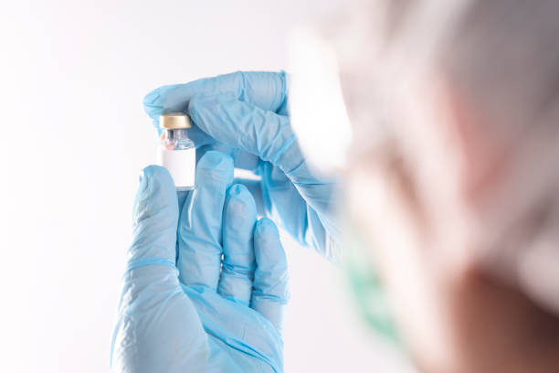 istock Female doctor is hanging a vaccine 1292143743