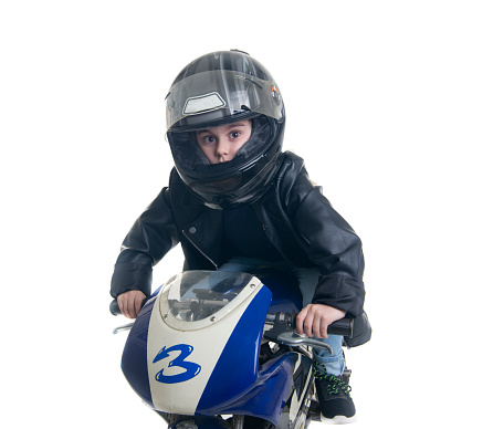 boy on his racing motorcycle with the number 3