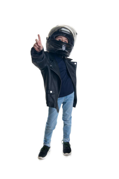 biker boy pointing up with his hand stock photo
