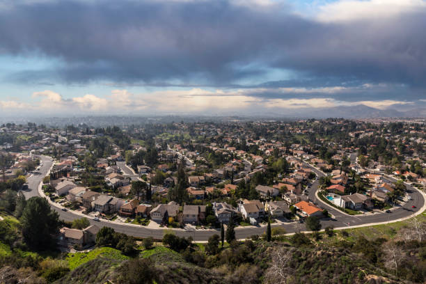 istock Los Angeles California Valley Homes with Storm Clouds 1292145740