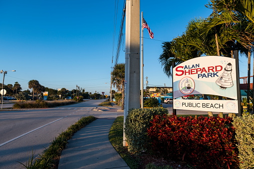 Cocoa Beach, Florida - December 18, 2020: A sign for Alan Shepard Park, a beachside park named after astronaut Alan Shepard and located near the famous Ron Jon Surf Shop.