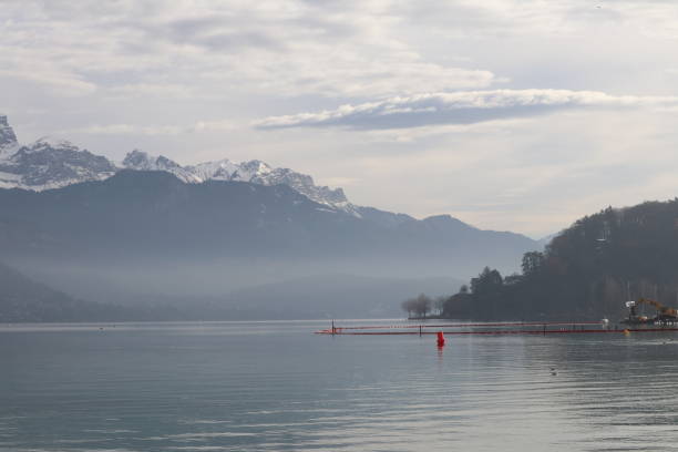 istock Lake Annecy under a cloudy sky 1292150750