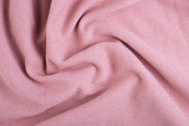 istock Twisted pink cotton material texture for the background 1292152819