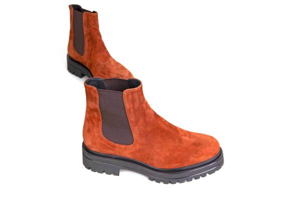 istock pair of boots isolated on white 1292154748