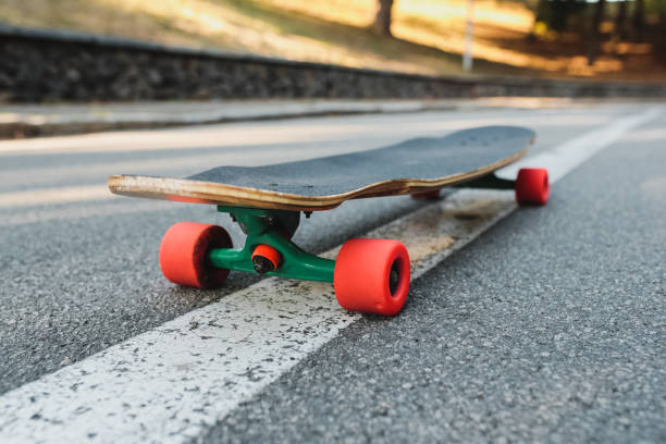 istock Longboard with red wheels on the asphalt. 1292157449