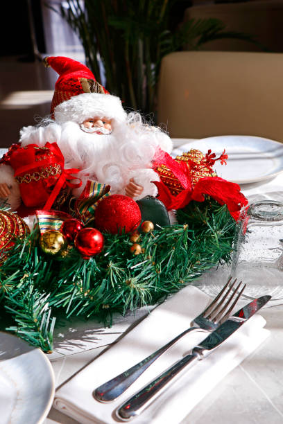 istock Santa Claus doll face with curly beard, toy santa on a dining table 1292159222