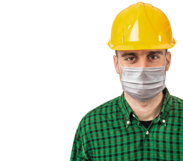 istock manual worker with face mask isolated on white 1292159961