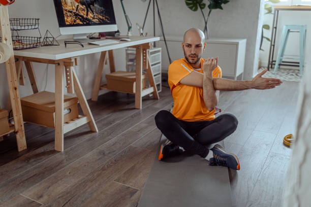 istock Young man working out at home 1292161710