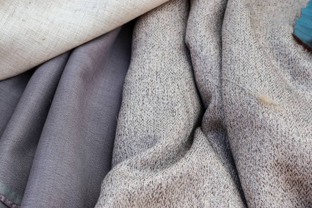 istock Detailed close up view on samples of cloth and fabrics in different colors found at a fabrics market 1292173064