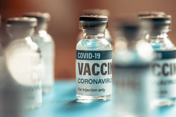 istock Covid-19 Coronavirus Vaccine vials in a row macro 1292188316