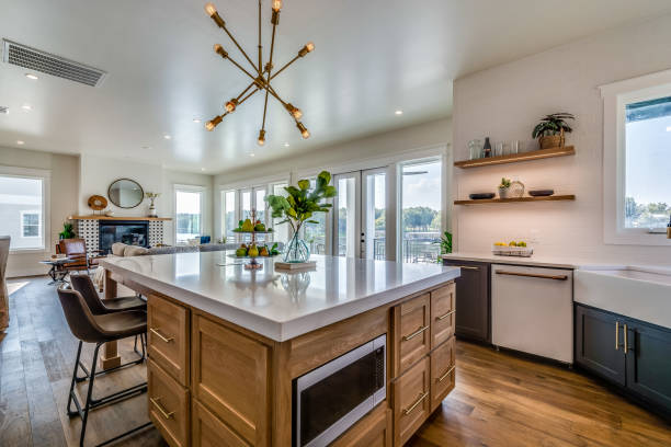 istock Modern pendant light hanging over small island 1292190748