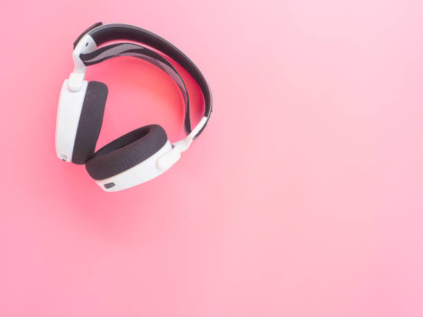 istock music headphones on pink background. 1292190866