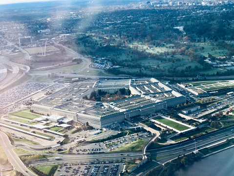 Houston, United States - April 13, 2023:  Aerial view of both the NRG Stadium, home to the NFL's Houston Texans, and the historic Astrodome, the first indoor sports arena, now listed as a historic site shot from an altitude of about 600 feet overhead during a helicopter photo flight.