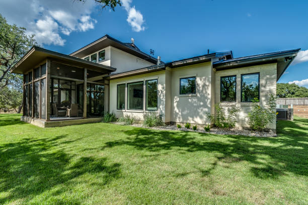 istock Back yard with sunroom enclosure on new home 1292195428