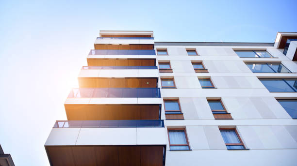 istock Modern apartment buildings on a sunny day with a blue sky. 1292195694