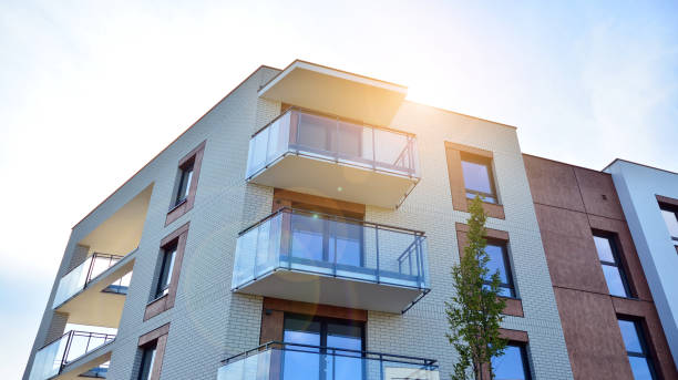 istock Modern apartment buildings on a sunny day with a blue sky. 1292195811