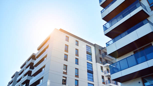 istock Modern apartment buildings on a sunny day with a blue sky. 1292196398