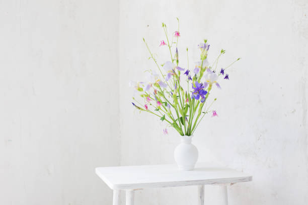 istock flowers in white vase in white vintage interior 1292196411
