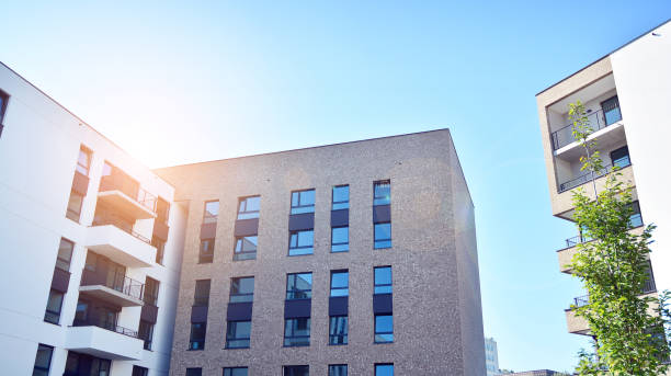 istock Modern apartment buildings on a sunny day with a blue sky. 1292196472
