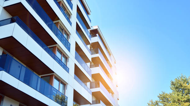 istock Modern apartment buildings on a sunny day with a blue sky. 1292196496