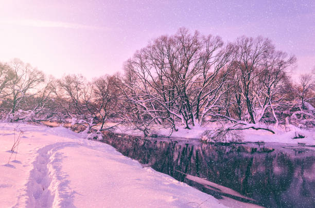 istock Frosty scene with flowing forest river on a sunny morning. 1292196552