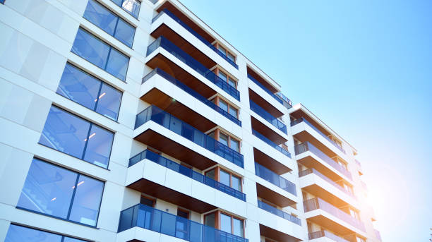 istock Modern apartment buildings on a sunny day with a blue sky. 1292196606