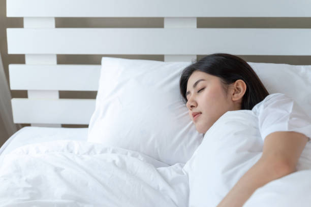 istock Young beautiful woman sleeping on the bed 1292199606