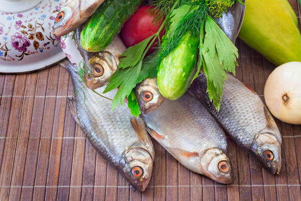 istock Fish and components for her preparation: vegetables, spices, parsley. 1292207964