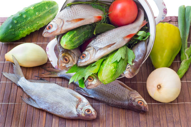 istock Fish and components for her preparation: vegetables, spices, parsley. 1292207993