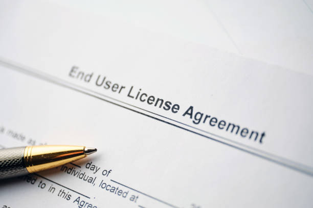istock Legal document End User License Agreement on paper close up 1292209250
