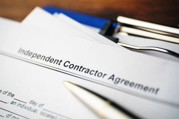 istock Legal document Independent Contractor Agreement on paper close up 1292209273