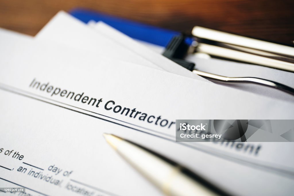 Legal document Independent Contractor Agreement on paper close up Legal document Independent Contractor Agreement on paper close up. Building Contractor Stock Photo