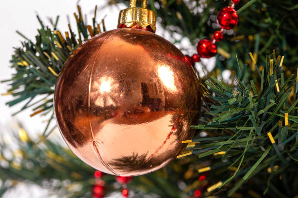 istock Christmas tree with pink balls on a white background 1292211181