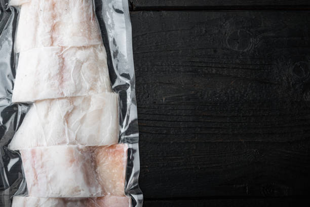 istock Raw haddock fish skinless, plastic vacuum packaged, top view with copy space for text 1292211196
