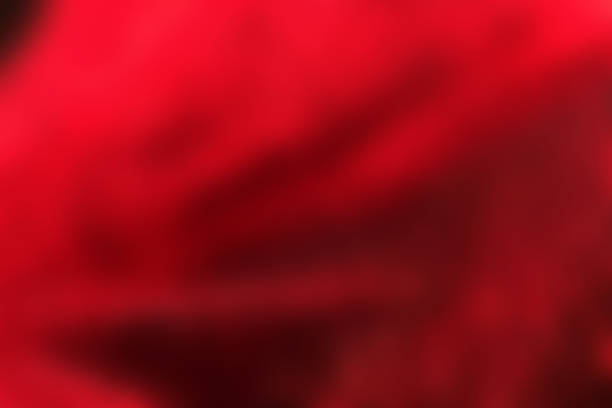 istock Red folds, abstract blurred background, soft fabric 1292211282