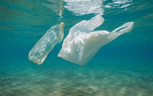 Underwater pollution, plastic bag and bottle in the sea, Mediterranean, France