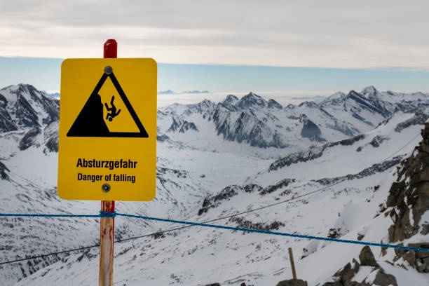 danger of falling sign in winter landscape in Austria