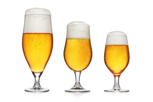 istock Tree glasses of light yellow beer isolated on white. 1292216437