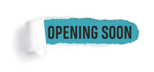 istock Hole in white paper with torns edges - Opening soon 1292217332