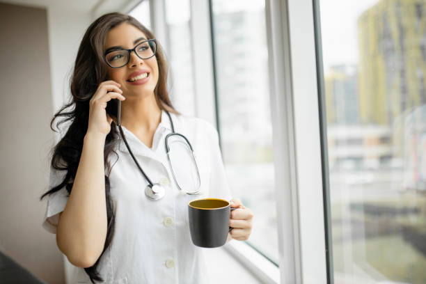 istock Doctor having coffee break and having video call 1292217465