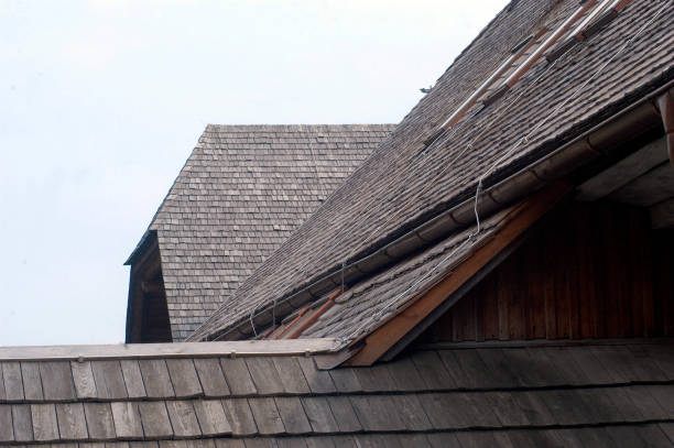 istock wooden shingle on a house roof 1292218476